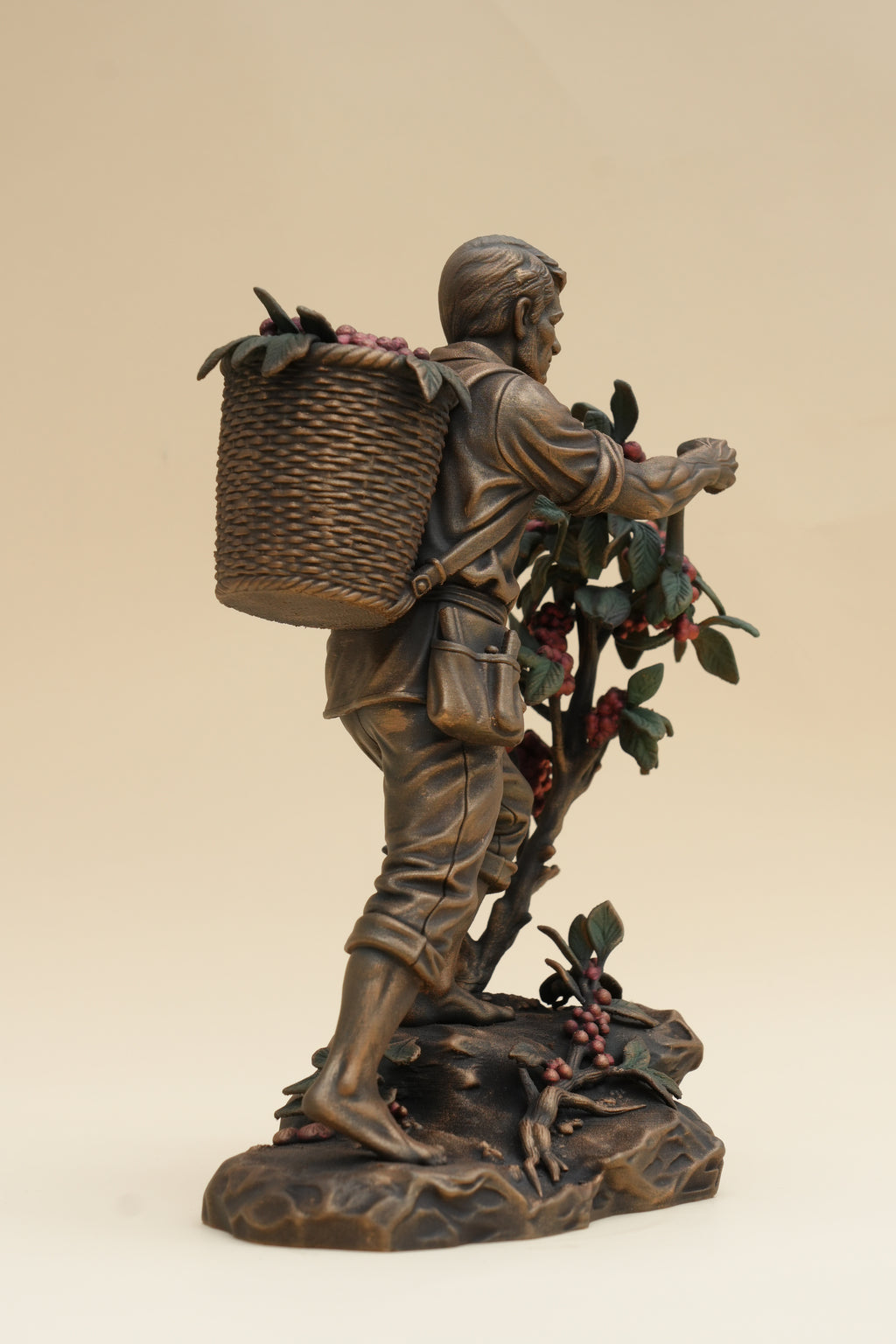 Coffee Harvester sculpture, coffee branches and painted berry detail